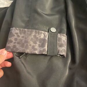 Stylish Black Coat with Patterned Cuffs